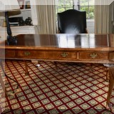 F18. Chippendale style writing desk with ball and claw feet and leather top. 30”h x 60”w x 30”d 